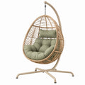 Fotel wiszący ogrodowy 105 x 105 x 195 cm z technorattanu beżowy z zielonymi poduszkami